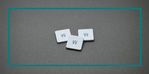 Three tiles on a grey background that say W. W. W.