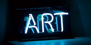 The word ART in neon letters