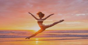 Dance and beach photography - a woman leaping during sunset over a large body of water